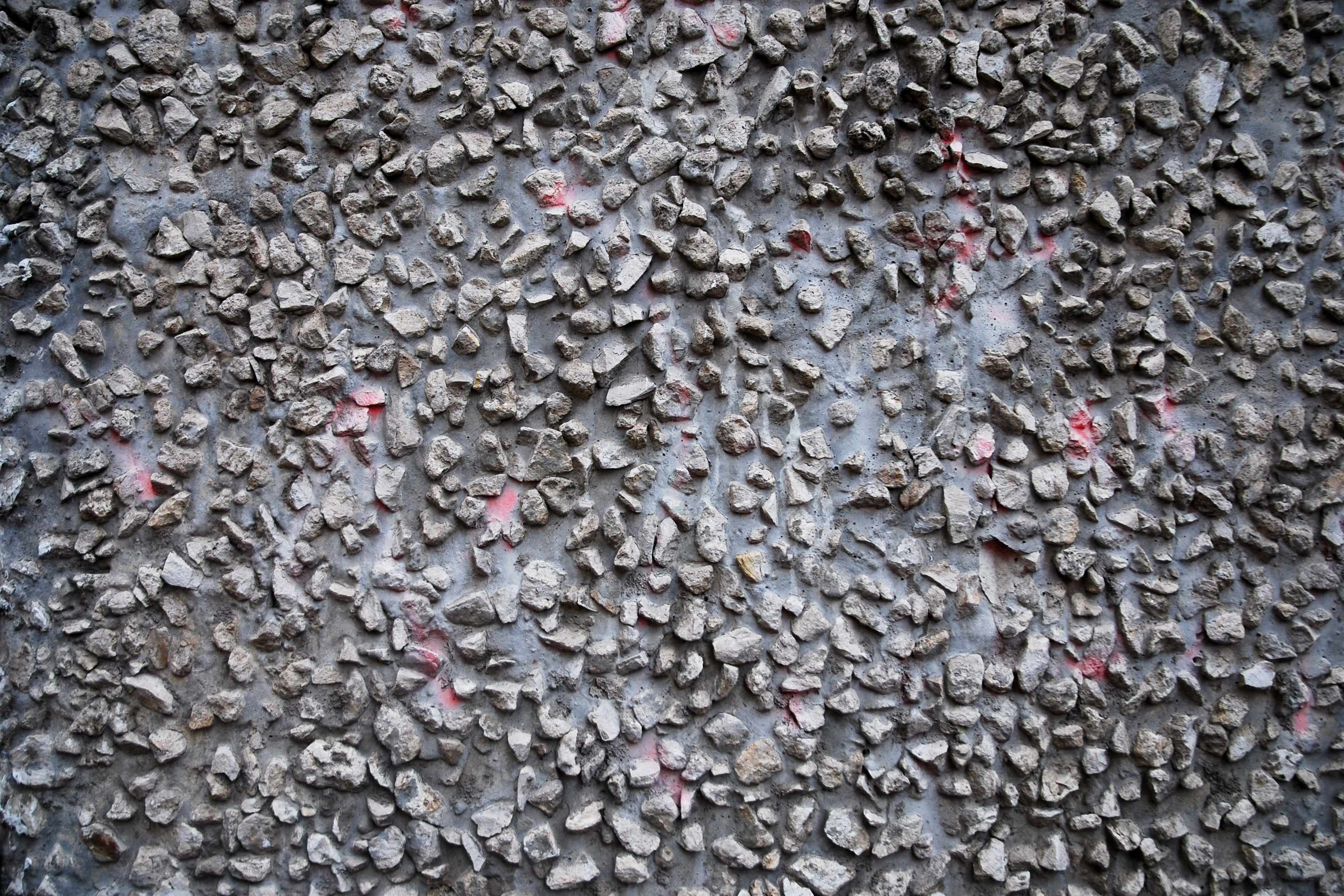 Car surface showing stone chips and minor paint damage from debris