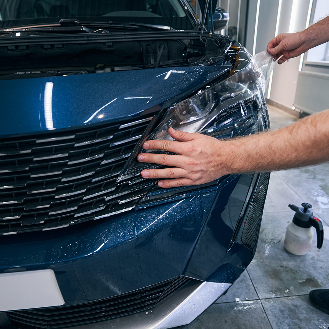 Applying Paint Protection Film (PPF) on car for scratch and paint protection