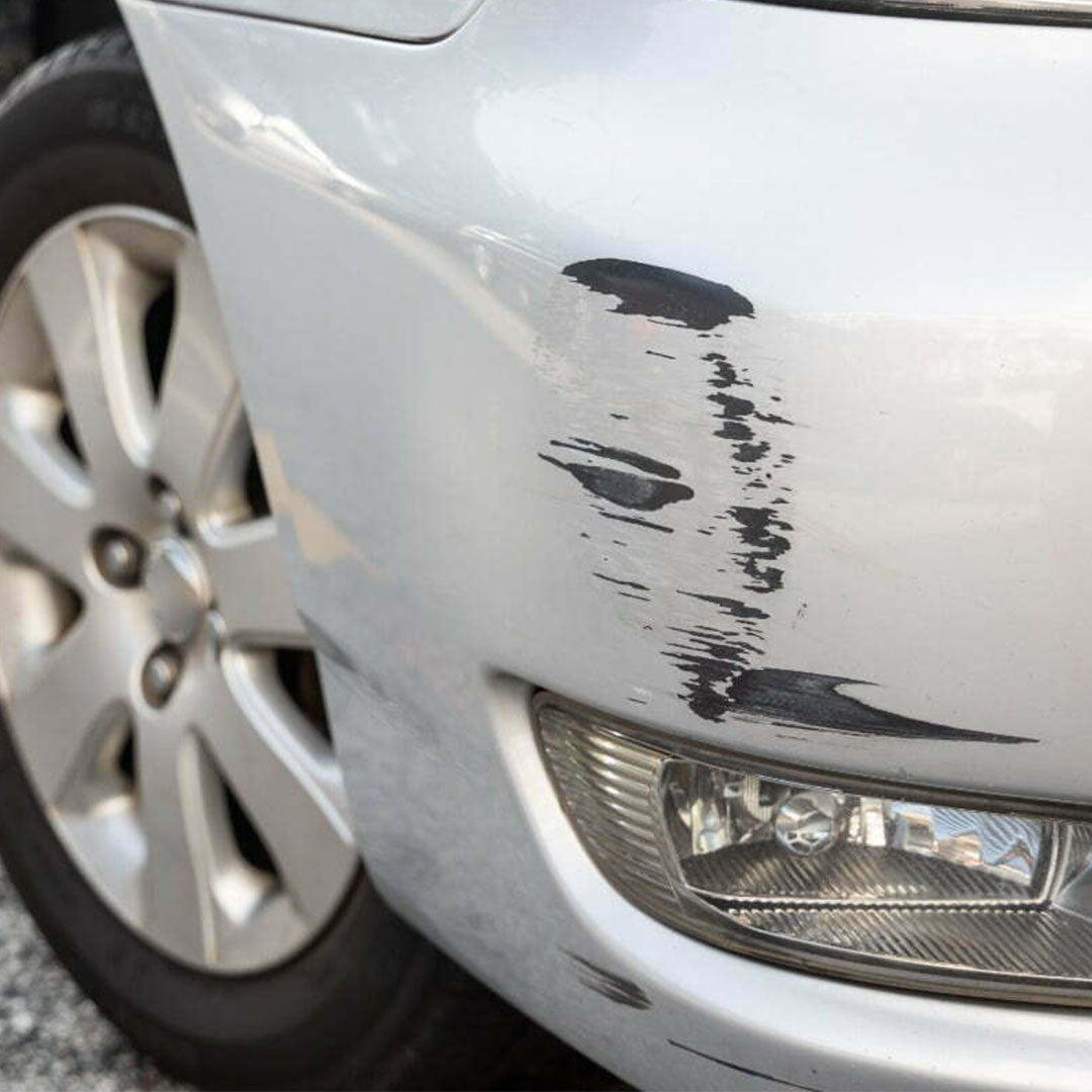 Close-up of paint scuff damage on vehicle surface